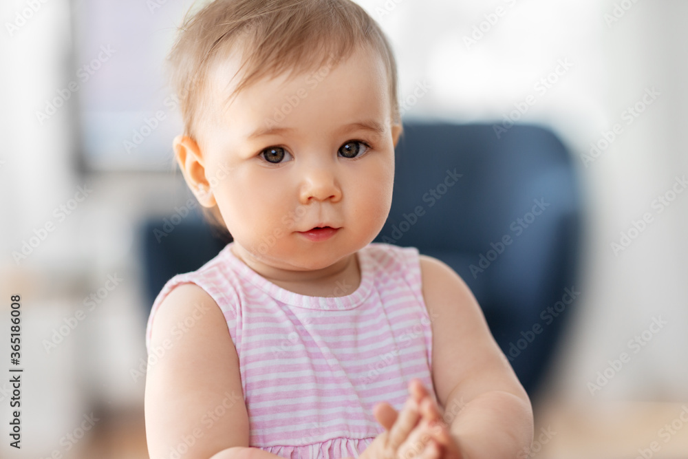 childhood and people concept - portrait of little baby girl at home