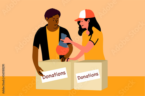 Support, charity, care, volunteering, help concept. Young smiling african american man boy woman girl volunteers standing with donation boxes with clothes food medicine supplies. Charitable foundation