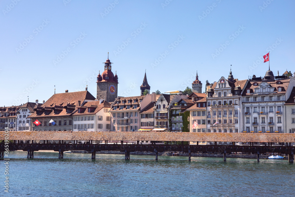 Buildings of old city of Luzerne and Kapellbrücke, wooden bridge over the Reuss River. Swiss Cityscape.