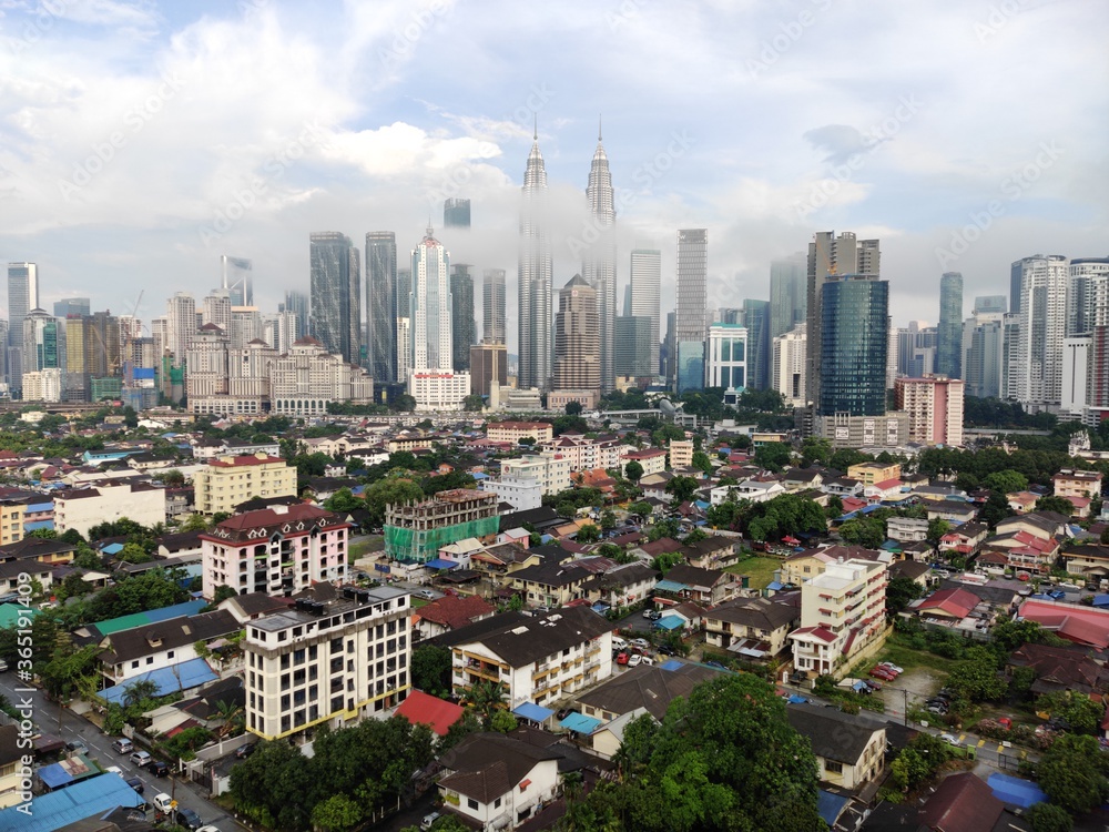 Kuala Lumpur, Malaysia - July 16, 2020: View of Kuala Lumpur skyline during after rain. 