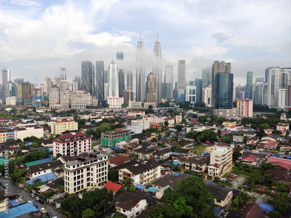 Fototapeta premium Kuala Lumpur, Malaysia - July 16, 2020: View of Kuala Lumpur skyline during after rain. 