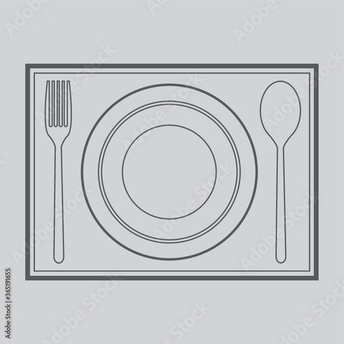 spoon, fork and plate on mat