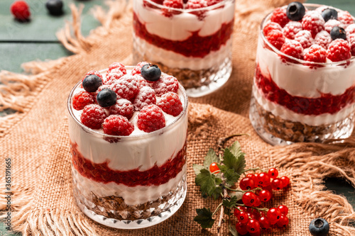 fresh raspberry, Yogurt parfait with granola and fresh berries, healthy breakfast concept