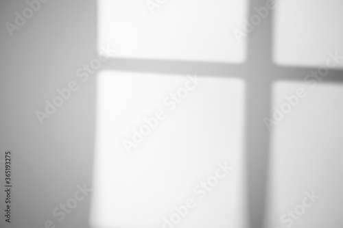 The shadow from the window on a white wall in sunny weather with bright light. Shadow overlay effect for photo.