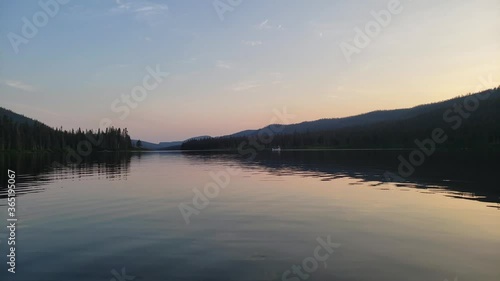 Wallpaper Mural Family Canoeing on a Lake at Sunset into the Horizon - Distant View Torontodigital.ca
