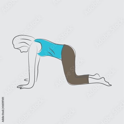 girl practising yoga in cat pose