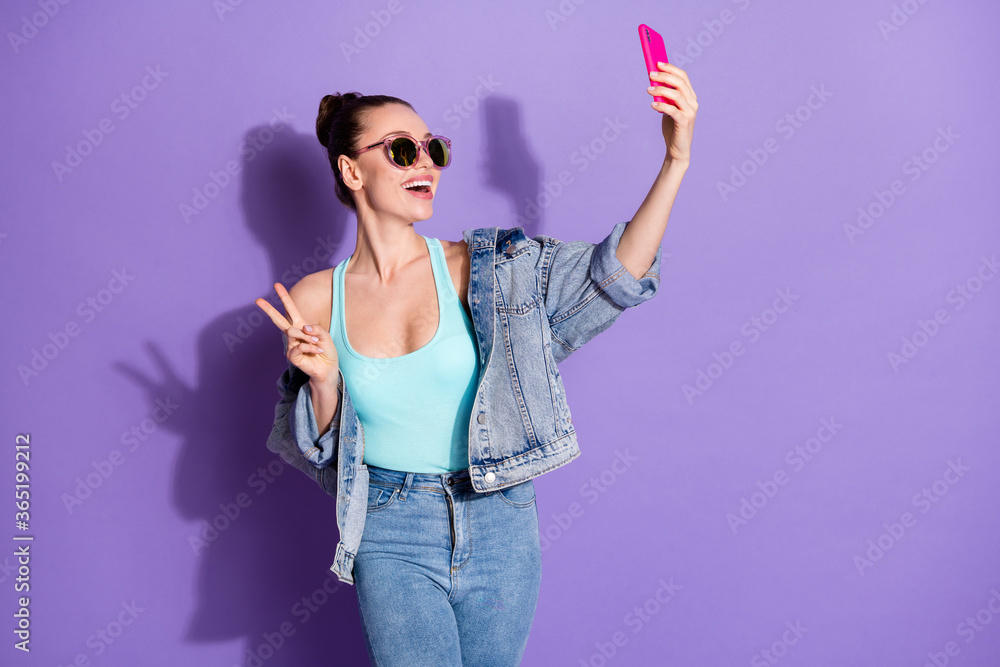 Portrait of her she nice attractive pretty cheerful cheery girl taking making selfie showing v-sign having fun isolated on bright vivid shine vibrant lilac purple violet color background Portrait of her she nice attractive pretty cheerful cheery girl taking making selfie showing v-sign having fun isolated on bright vivid shine vibrant lilac purple violet color background
