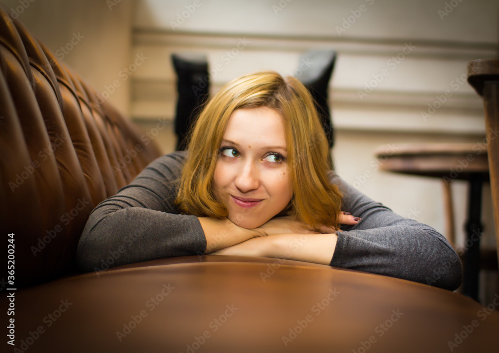 Young girl in the old-fashioned cosy place Young girl in the old-fashioned cosy place