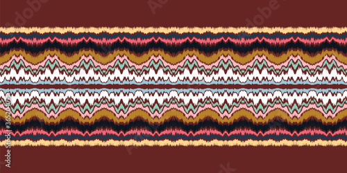 Ikat border. Geometric folk ornament. Ink on clothes. Tribal vector texture. Seamless striped pattern in Aztec style. Ethnic embroidery. Indian, Scandinavian, Gypsy, Mexican, African rug.