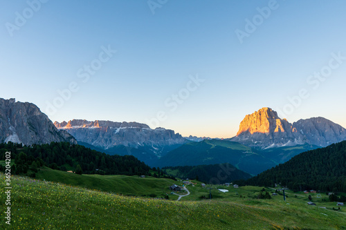 Dolomite mountain landscape at sunrise from Seceda peak, Italy.