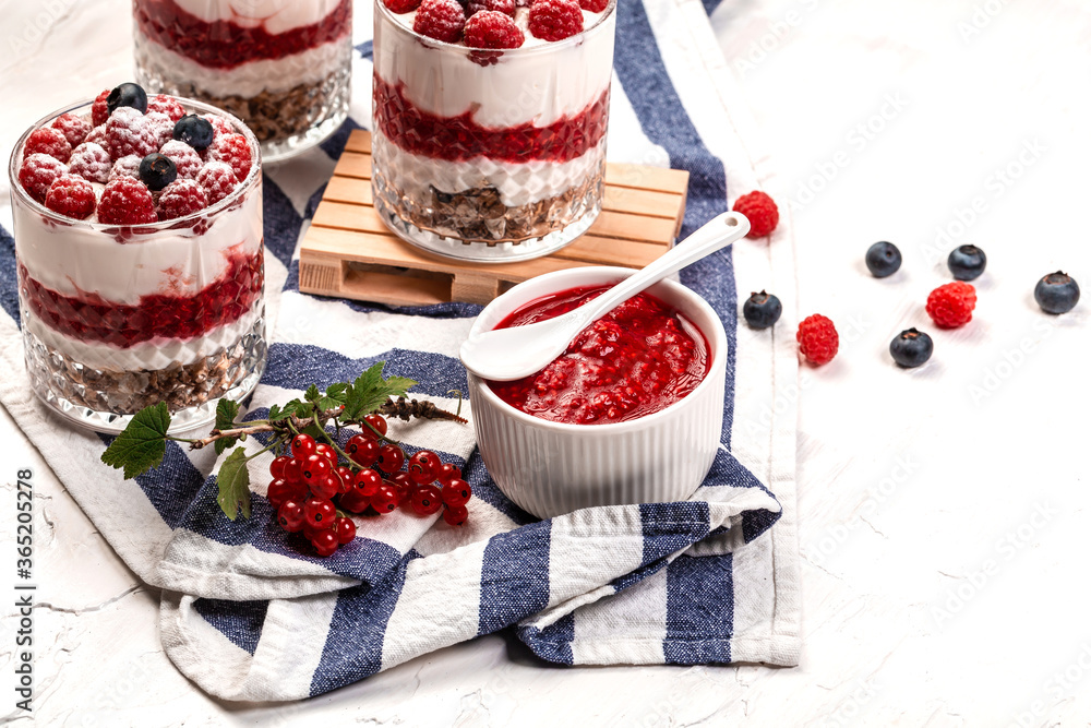Yogurt parfafait with granola and berries. Sweet and healhty breakfast dessert, Yogurt, blueberries and raspberries Yogurt parfafait with granola and berries. Sweet and healhty breakfast dessert, Yogurt, blueberries and raspberries