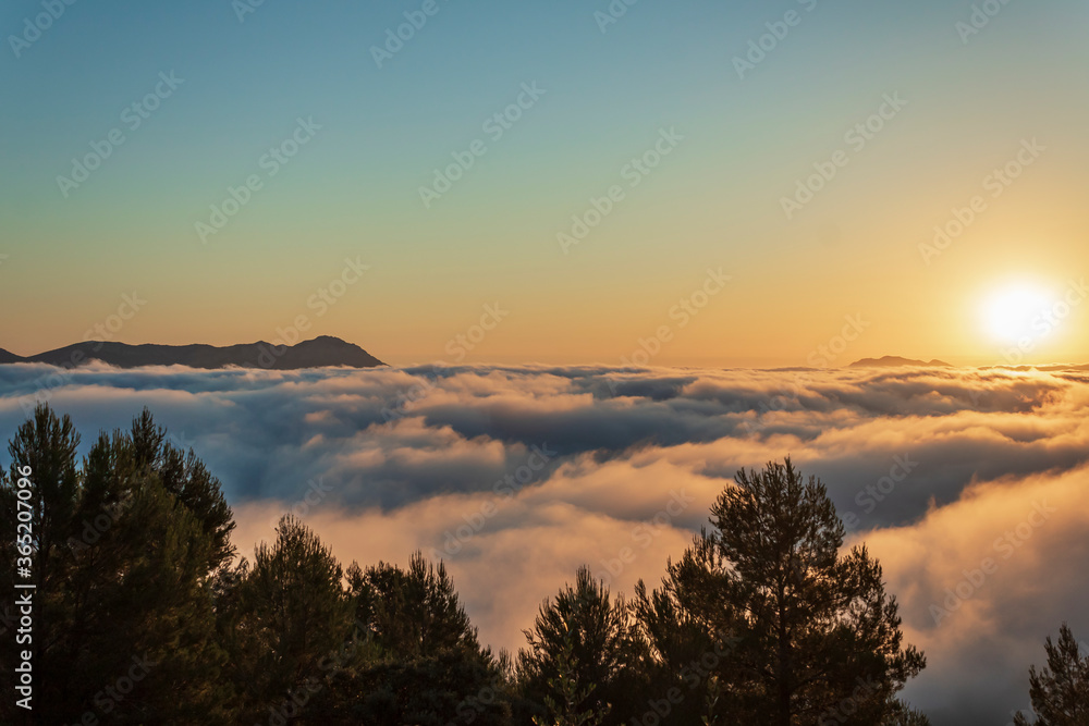 Sunrise views from the Montcabrer mountain in a day with clouds, Cocentaina.