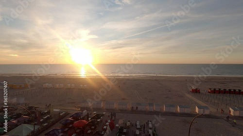 high angle view above the sandy beach at north sea - sunset timelapse at the belgian coastline photo