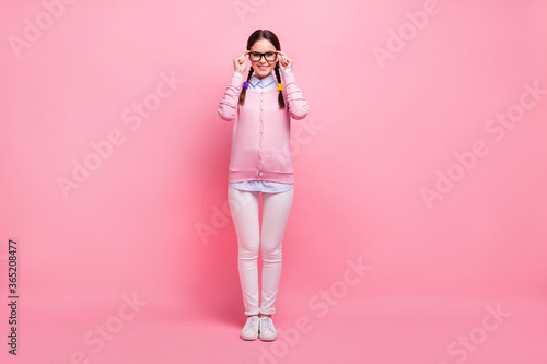 Full length body size view of her she nice attractive lovely pretty cute smart clever cheerful cheery girl geek wearing touching specs isolated over pink pastel color background