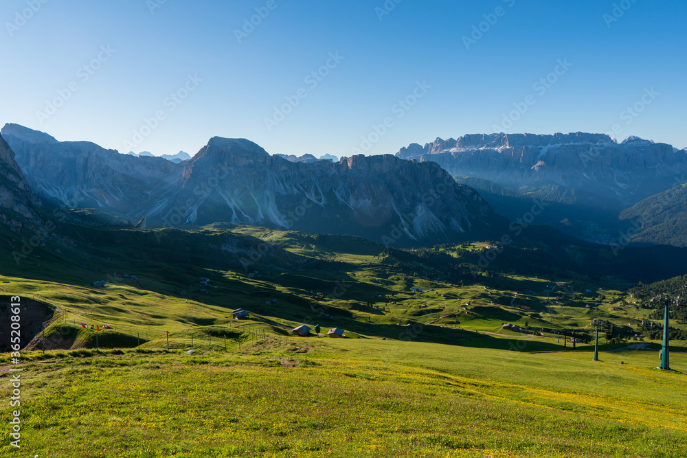 Beautiful alpine countryside. Awesome Alpine landscape with traditional huts. Amazing Nature Scenery of Dolomites Alps. Epic Scene in the mountains place near Seceda peak. Val Gardena. Dolomiti alp.
