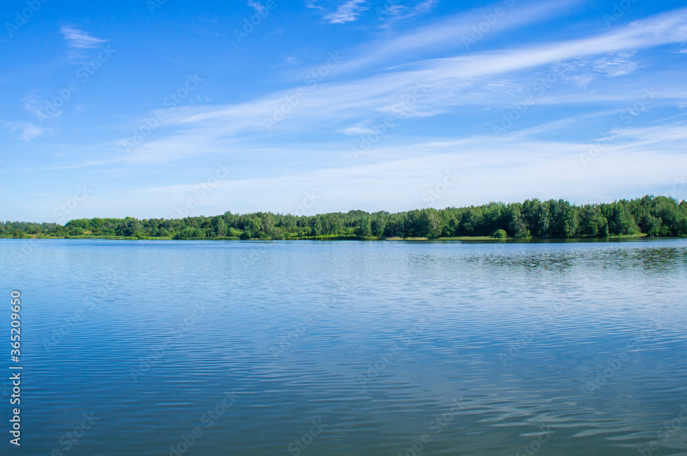 Blue lake with sky reflection in the water