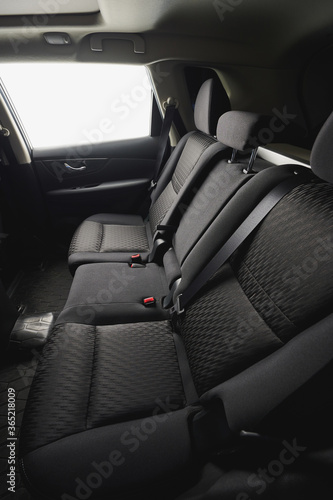 Clean black material car back seat © PixieMe