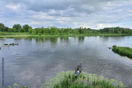 Angler and fisherman fish on the shore, next to the boat.