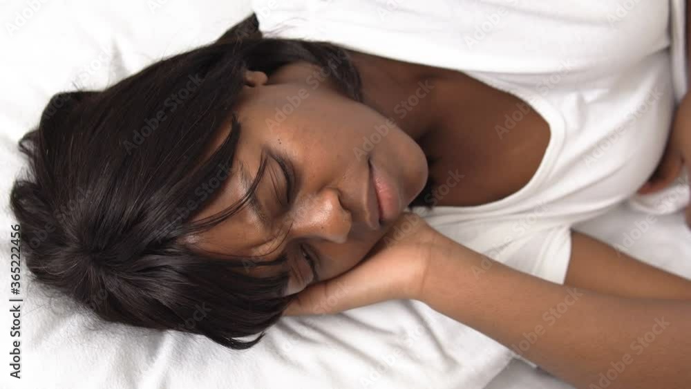 African american woman sleeping in bed, resting after hard working day, dreams African american woman sleeping in bed, resting after hard working day, dreams