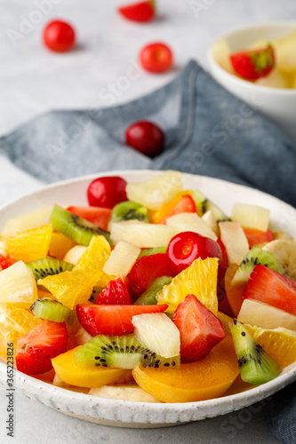 Fresh chopped fruit salad in a bowl.