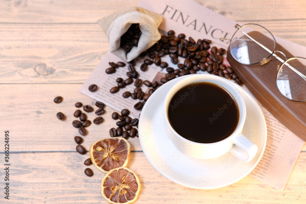Top view coffee cup and coffee beans on wooden table background and space for text Top view coffee cup and coffee beans on wooden table background and space for text
