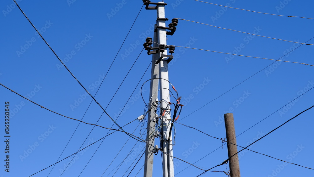 Electric pole with wires in the countryside
Electric pole with wires in the countryside