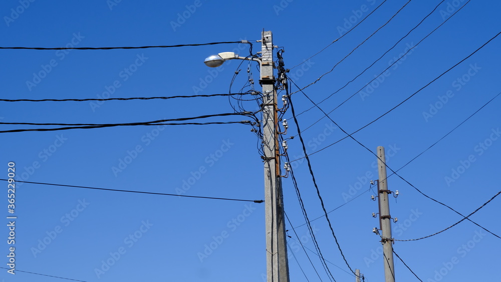 Electric pole with wires in the countryside
Electric pole with wires in the countryside