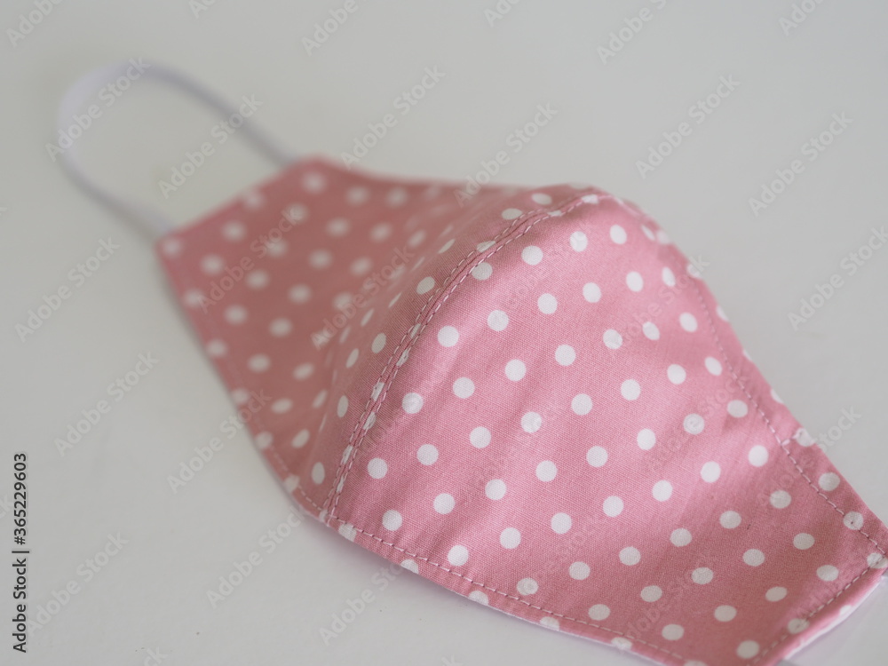 Dot white on pink fabric face mask cloth for protect dust and germs pm 2.5, coronavirus covid-19 Dot white on pink fabric face mask cloth for protect dust and germs pm 2.5, coronavirus covid-19
