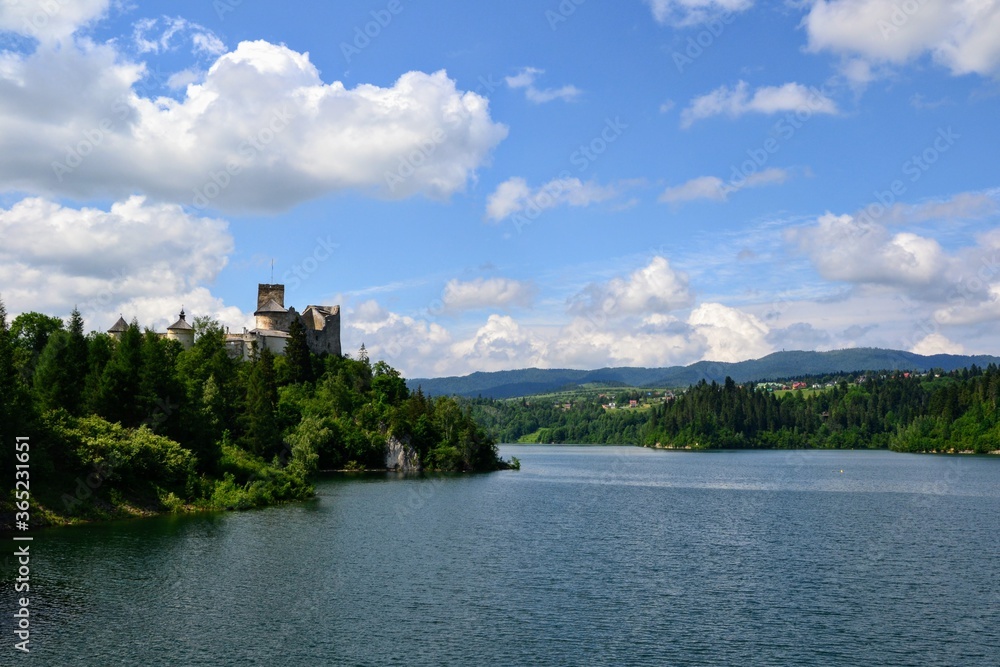 Lake Czorsztyn and medieval castle in Niedzica. The beauty of nature and architecture in Southern Poland. Medieval Castle in Niedzica, built in 14th century and artificial Czorsztyn Lake
