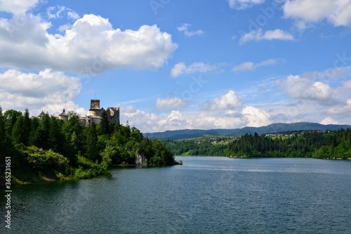 Lake Czorsztyn and medieval castle in Niedzica. The beauty of nature and architecture in Southern Poland. Medieval Castle in Niedzica, built in 14th century and artificial Czorsztyn Lake