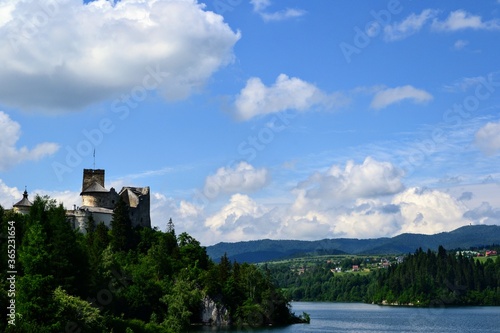 Lake Czorsztyn and medieval castle in Niedzica. The beauty of nature and architecture in Southern Poland. Medieval Castle in Niedzica  built in 14th century and artificial Czorsztyn Lake
