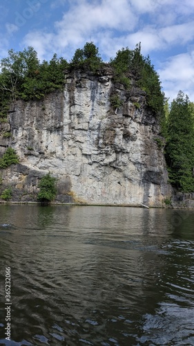 Kayaking on a river near rock