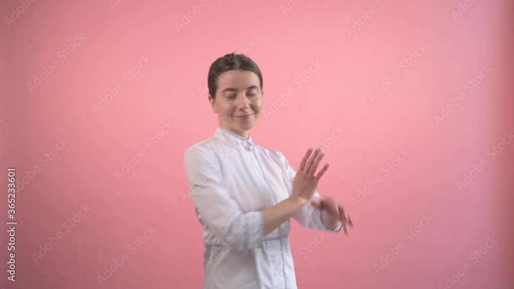 Beautiful woman doctor in a medical coat. He turns his face and smiles. Beautiful woman doctor in a medical coat. He turns his face and smiles.
