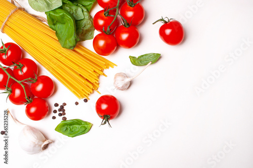 Spaghetti, cherry tomatoes and basil. Cooking pasta at home. Flat Lay Style