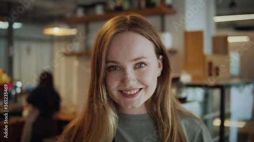 Wallpaper Mural Portrait of happy woman standing in her cafe coffee shop. Cheerful young waitress waiting for clients at coffee shop. Successful small business owner in casual wearing grey apron standing at entrance Torontodigital.ca