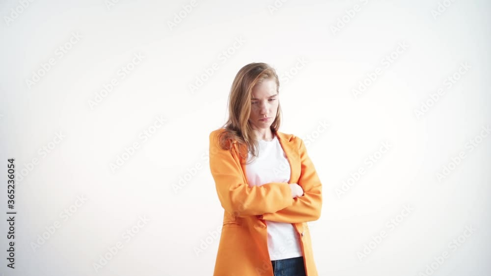 Offended beautiful girl looks in the frame. Displeased face. Offended beautiful girl looks in the frame. Displeased face.