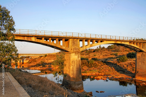 Gadea Bridge at dawn, located between La Palma del Condado and Villarrasa, is an old bridge from 1935 that is part of the Vía Verde del Río Tinto