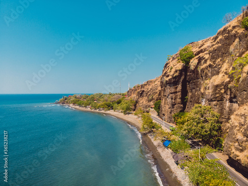 Aerial view of sea with rocks and road in Northern Bali