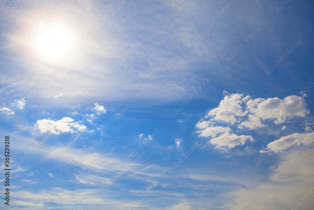Sundial and light clouds . Summer daytime heaven Sundial and light clouds . Summer daytime heaven