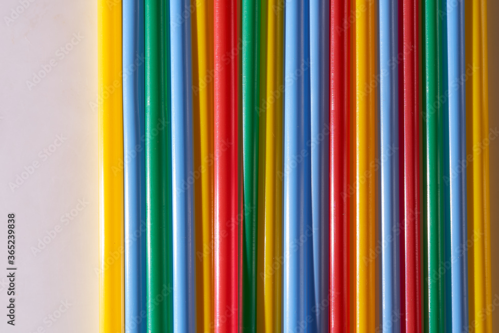 Abstract Background Multicolored Plastic Drinks Tubes. Close-up. Abstract Background Multicolored Plastic Drinks Tubes. Close-up.