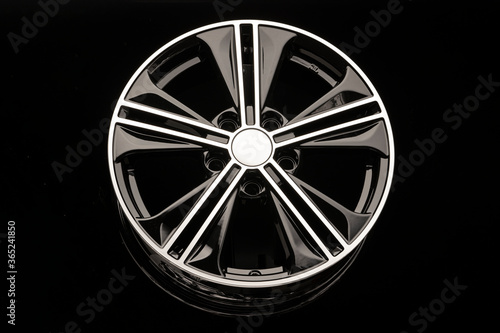 black alloy wheel on dark background close up