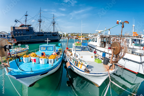 Tourist "Pirate Ship" and moored fishing boats in harbour at Ayia Napa. Famagusta District. Cyprus
