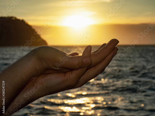 The sun on female hand. Hand is holding sun © rdonar