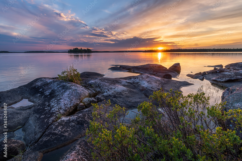 Sunset from a rocky island on a lake in Northwest Ontario, Canada.