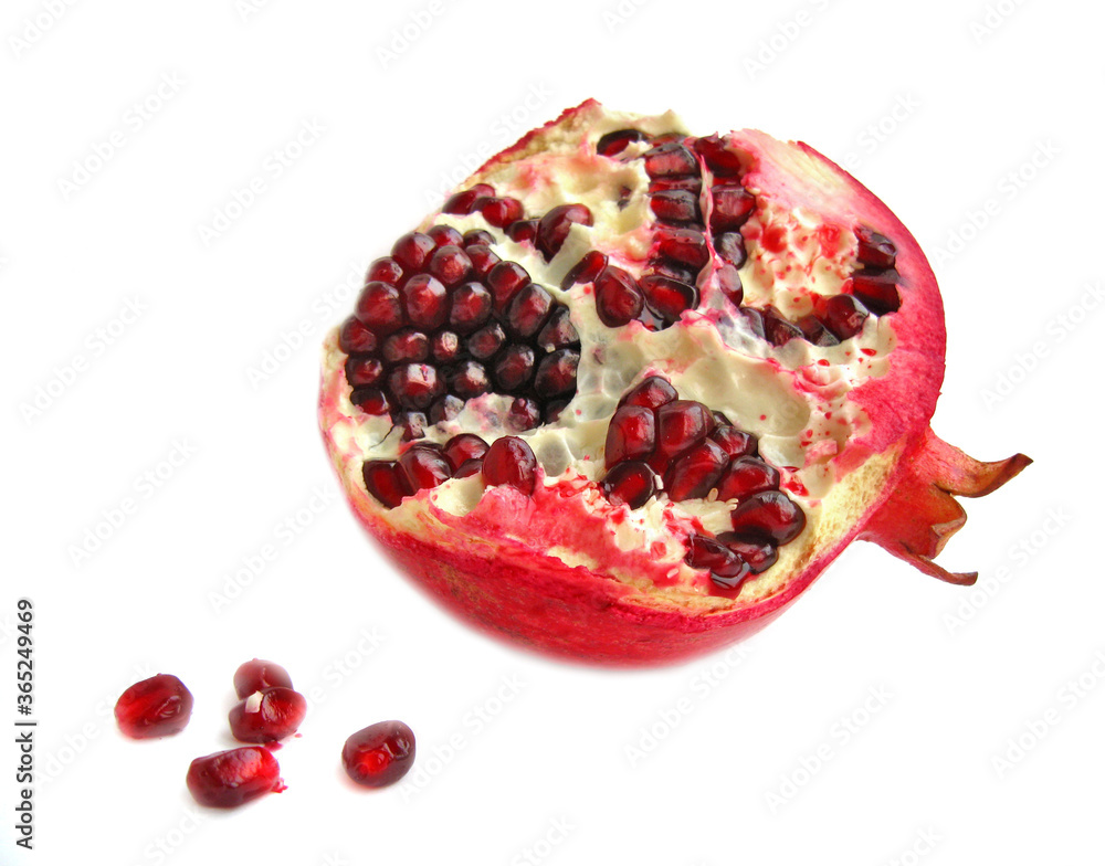 Pomegranate with seeds isolated on a white background. Pomegranate with seeds isolated on a white background.