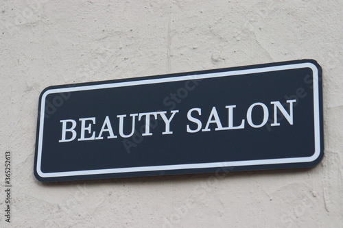beauty salon nameplate on wall