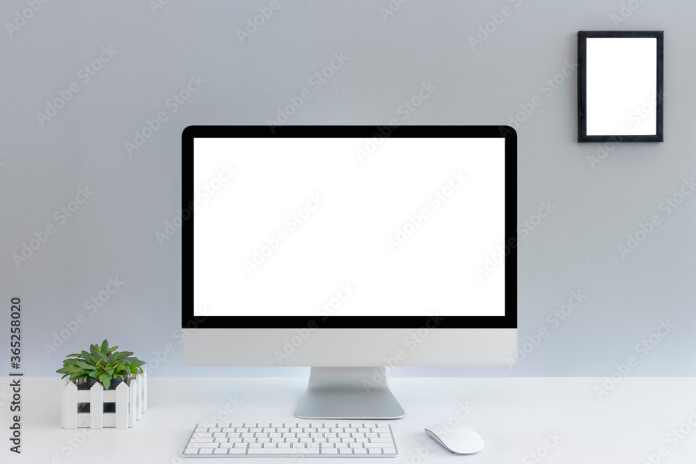 Computer with blank white copy space for text, Mockup design desktop computer in office on white table with keyboard and Coffee cub, Work place concept. Computer with blank white copy space for text, Mockup design desktop computer in office on white table with keyboard and Coffee cub, Work place concept.