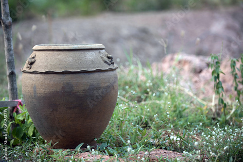 Old pottery with water in the garden