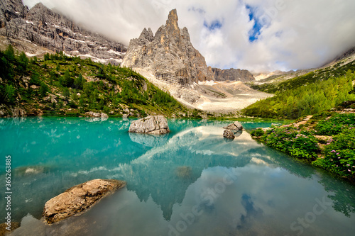 Turquoise Sorapis Lake near Cortina d'Ampezzo, with Dolomite Mountains and Forest - Sorapis Circuit, Dolomites, Italy, Europe, summer picture.