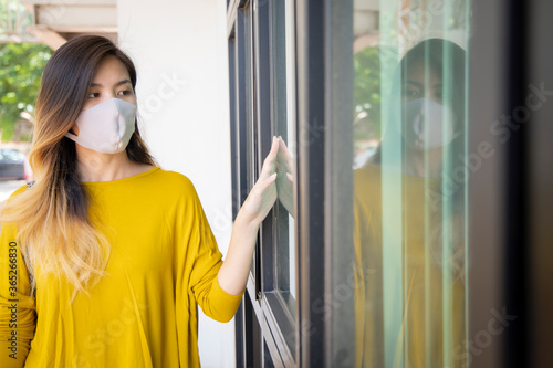 Asian women are wearing a health mask to prevent dust and corona virus. Free Download Asian women are wearing a health mask to prevent dust and corona virus. - GFXLoad